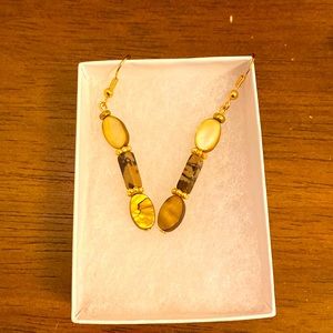 Gold tone dangle earring with beautiful stones